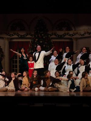 Briggs as Oliver Warbucks with full cast in JaDuke's recent production of Annie the Musical