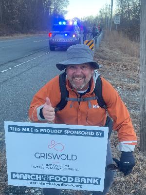 Team captain, Kirby at last years mile marker (2024)